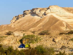 Our camp under dramatic rock formations
